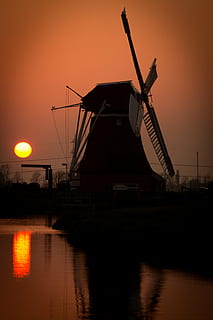 mill, sunset, dusk, orange, sun, night, dutch, europe, windmill, wind, tourism, water, reflection, silhouette, nature, back Lit, sky, waterfront, environmental conservation, wind power, wind turbine, alternative energy, orange color, turbine, fuel and power generation, architecture, renewable energy, no people, built structure, lake, 4K, CC0, public domain, royalty free